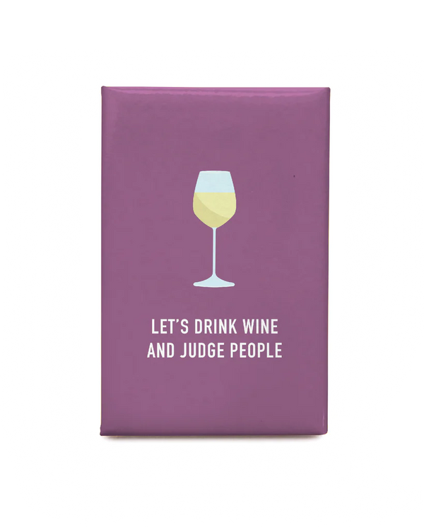A purple magnet with a picture of a wine glass and the words 