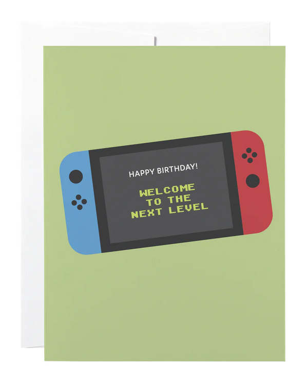 A sage green card with a picture of a nintendo switch and the words 