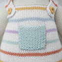 A close up of the rainbow overalls with a blue pocket in the middle