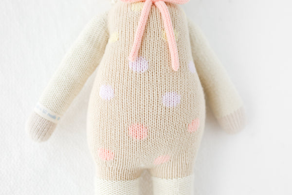 A close up shot of the lamb stuffy's overalls