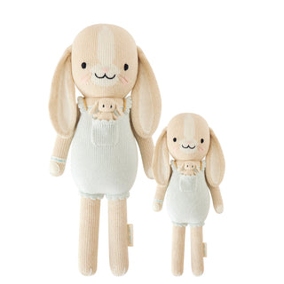 Bunny plush wearing light blue overalls with a mini bunny in the pocket