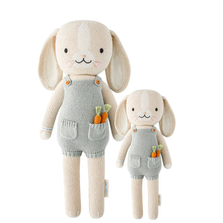 2 different sized bunny stuffies wearing blue overalls