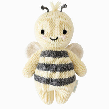 cuddle + kind Baby Animals - Handmade knitted baby bee toy with smiling face, soft cream and black stripes, unique Canadian gift.