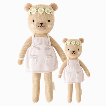 Olivia the Honey Bear - Handmade knitted honey bear doll wearing pink overalls and floral crown, unique Canadian gift.