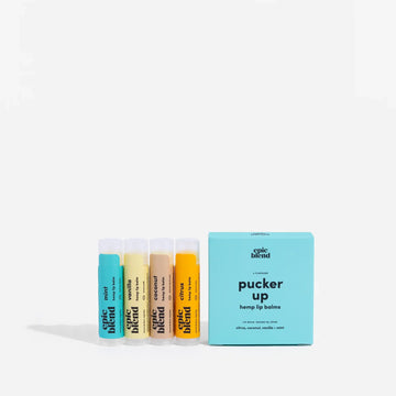 Pucker Up Hemp Lip Balm 4-Pack Kit/Bundle - Set of four handmade Canadian hemp lip balms with pastel yellow, beige, and blue tubes, plus blue branded gift box.