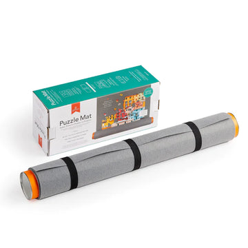 Roll Up Puzzle Mat - Rolled gray fabric puzzle mat with black straps and orange ends, handmade Canadian gift packaging visible.
