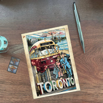 Toronto, A World Class City Postcard | Rob Croxford - Vintage-style Toronto postcard with a red streetcar, detailed cityscape, and bold "TORONTO" text on woodgrain background.