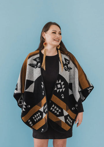 Mini Tipi Reversible Shawl (Indigenous Designed) - various patterns - Handmade reversible shawl with geometric Indigenous patterns in black, brown, and gray, styled as a gift-ready Canadian.