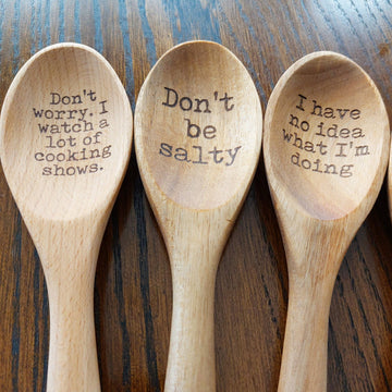 Funny Humor Laser Engraved Wooden Spoon - Set of three light wood spoons with laser-engraved humorous sayings in black text.