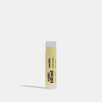 Vanilla Lip Balm - Vanilla lip balm in a sleek tube with black text, unique handmade Canadian gift.
