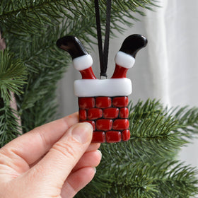 Decoration of Santa Claus caught in the Chimney for the Christmas Tree