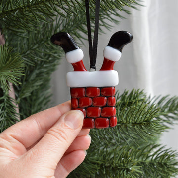 Decoration of Santa Claus caught in the Chimney for the Christmas Tree