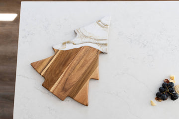 Christmas Tree Resin Charcuterie Board - Christmas tree-shaped resin and wood charcuterie board with white marbled top and natural wood base.