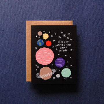 Around the Sun Birthday Card - Handmade birthday card with colorful planets and stars on black, unique Canadian gift design.