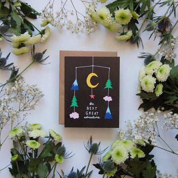 Baby Mobile Card - Handmade Canadian baby mobile greeting card with colorful stars, moon, clouds, and trees on dark background, unique gift.
