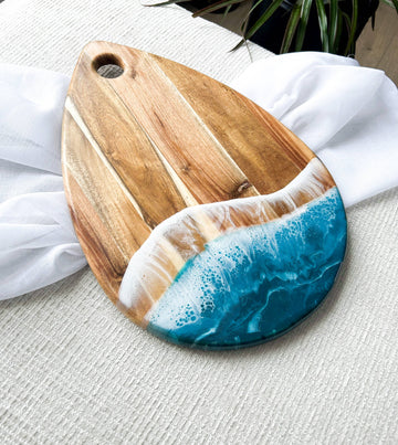 Rain Drop Shaped Charcuterie Boards - Handmade Canadian wooden charcuterie board with ocean blue resin, unique raindrop shape gift.