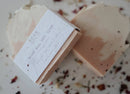Rosé All Day Soap Bar - Two handmade beige soap bars with natural, uneven edges; one wrapped in textured white paper labeled Rosé All Day Soap Bar.
