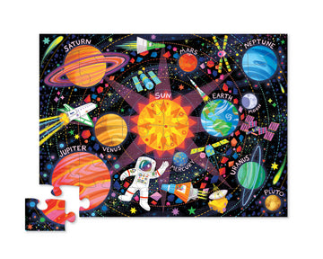36 PC Puzzle: Space Explorer - Colorful 36-piece space-themed jigsaw puzzle with planets, astronaut, and stars on black background.
