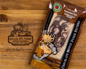 Fudge - Peanut Butter Swirl - Rectangular bar of fudge with a swirled peanut butter and chocolate pattern in clear packaging with a cartoon moose logo on.