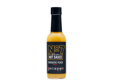 Habanero Peach No7 Hotsauce - No7 Hotsauce Habanero Peach hot sauce bottle with black label, unique handmade Canadian gift.