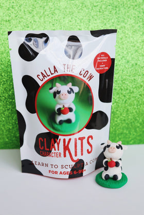 Clay Character Kits - Clay Character Kit featuring handmade Canadian Calla the Cow on green base, unique arts and crafts gift packaging.