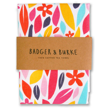 Wildflower Tea Towel - Handmade Canadian cotton tea towel with vibrant pink, orange, yellow, and navy floral pattern, perfect unique gift.