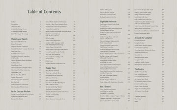 The Essential Cottage Cookbook - Open cookbook titled The Essential Cottage Cookbook showing detailed table of contents pages with organized recipe.