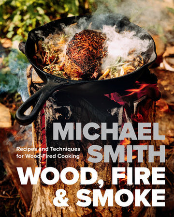Wood, Fire & Smoke - Cast iron skillet over open flame grilling a seasoned roast with smoke rising, handmade Canadian cooking gift idea.