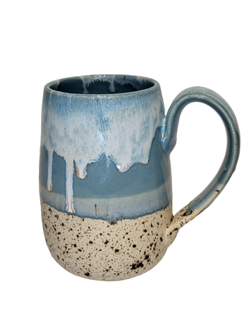 Winterwood Mug - Ceramic mug with speckled beige base and glossy blue glaze dripping over textured upper half, rounded handle.