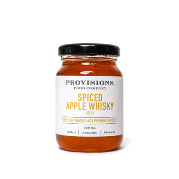 Spiced Apple Whisky Jelly - Handmade Canadian spiced apple whisky jelly in clear glass jar with black lid, unique gourmet gift.