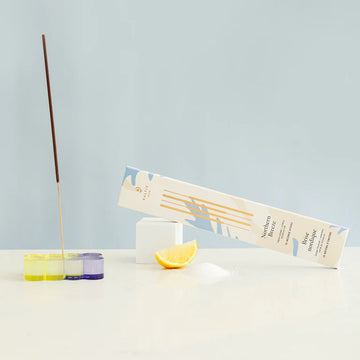Incense Sticks - Northern Breeze - Set of colorful glass incense holders in purple, yellow, and clear glass, paired with slender brown incense sticks and.