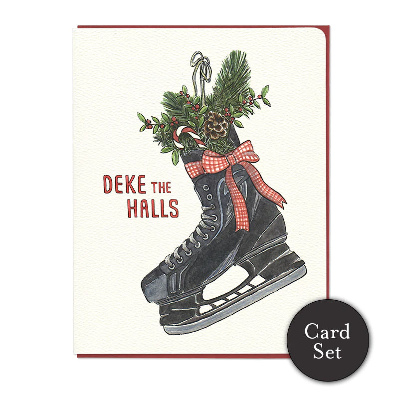 A white card with a black skate filled with pine, holly and candy canes next to red font reading "Deke the halls"