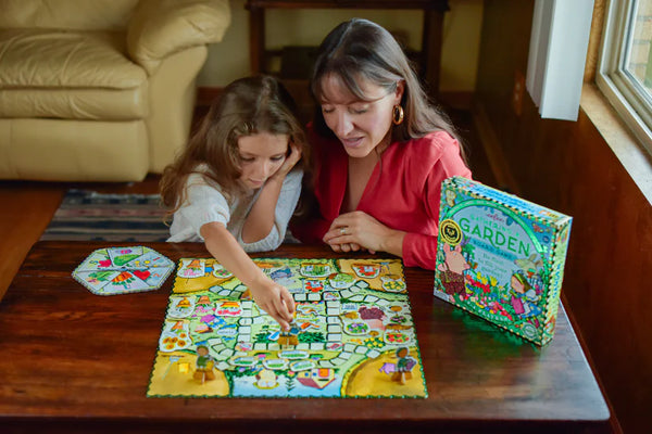 Kids playing the Gathering a Garden Board Game