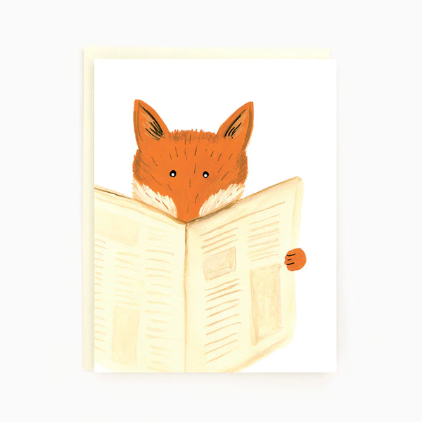 A white card with a red fox reading a newspaper