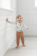 A baby wearing All Aboard Long Sleeve Bodysuit (Loulou Lollipop)