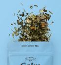 The top quarter of the bag is visible with a blend of tea leaves spilling out