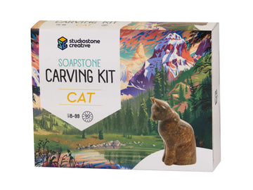 Cat Soapstone Carving Kit - Cat Soapstone Carving Kit box featuring handmade Canadian cat sculpture with mountain landscape background, unique gift idea.