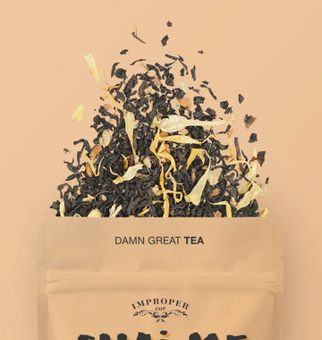 Chai Me A River Tea - Handmade Canadian tea pouch labeled Damn Great Tea with loose black tea leaves and flower petals spilling out, unique gift.