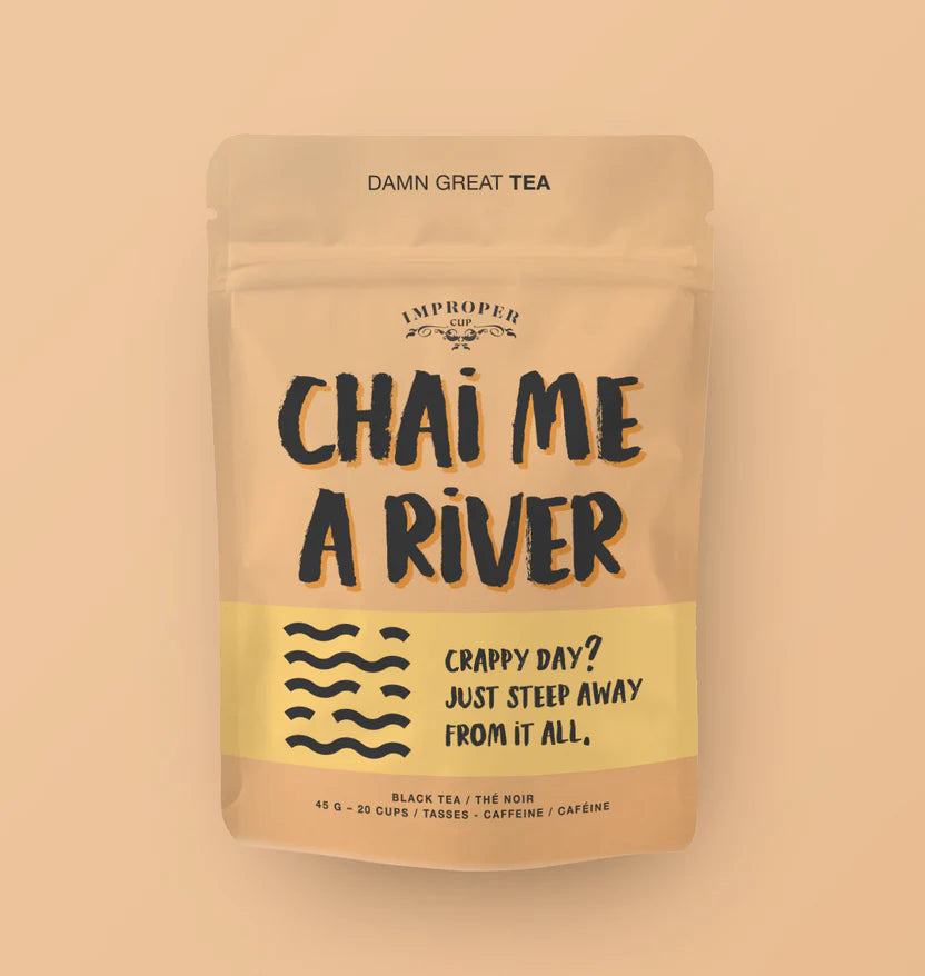 A pink bag with large black text reading "CHAI ME A RIVER" with an illustration of waves below