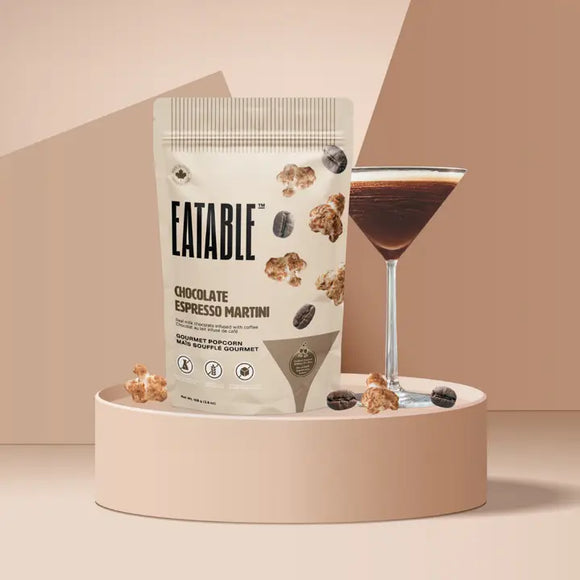 Chocolate Espresso Martini - Gourmet Popcorn (Eatable) - Cream-colored resealable bag of chocolate espresso martini gourmet popcorn with dark brown popcorn pieces and a filled.