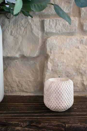 Lynn & Liana Limestone Lattice Holder - Creamy white limestone candle holder with textured lattice pattern and rounded shape.