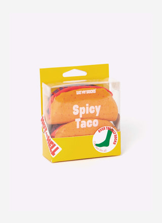 A yellow box with a clear top to display orange socks folded to resemble tacos
