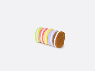 A green box with a clear panel to display multicoloured socks folded to resemble macarons