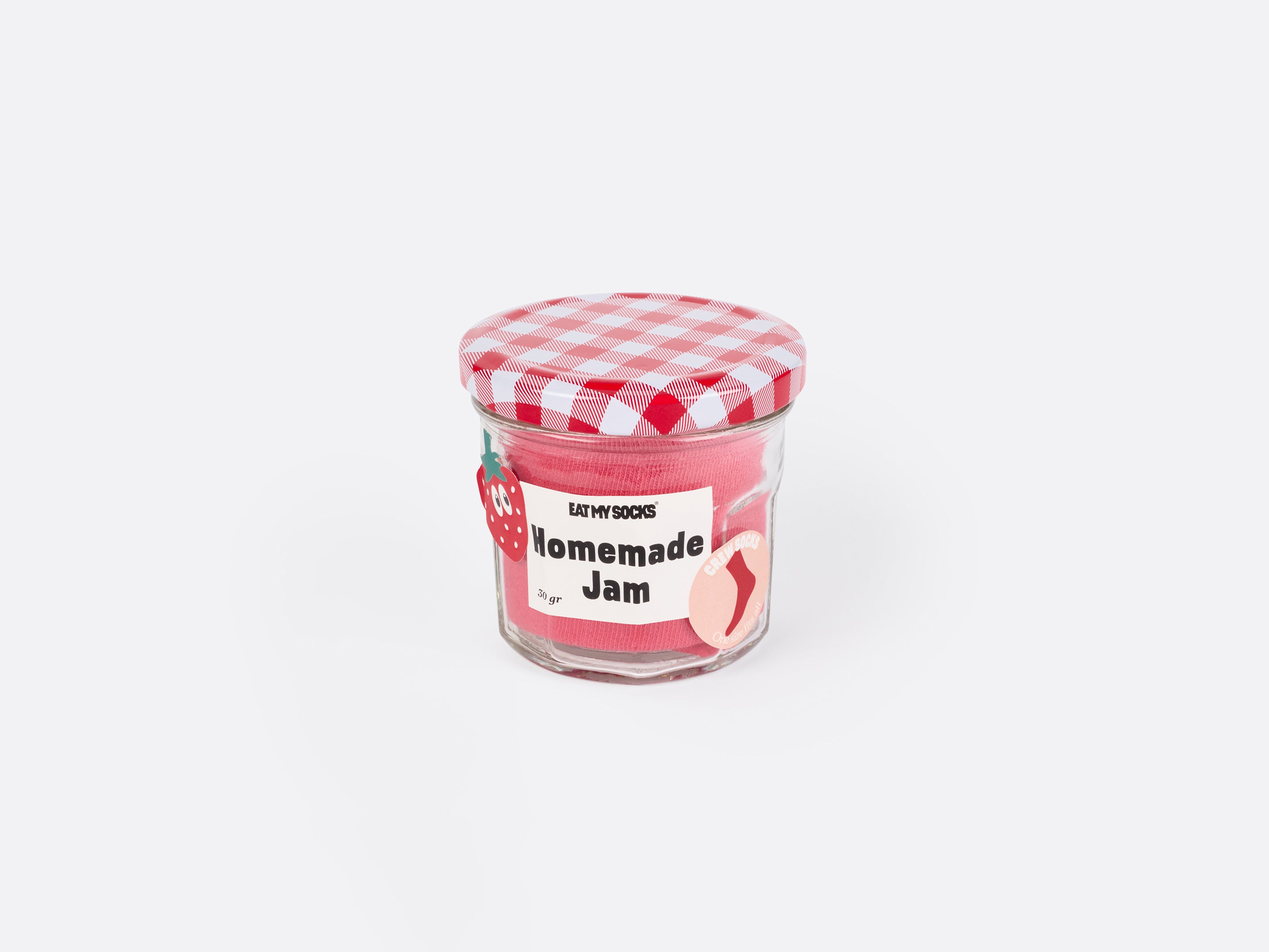 A jam jar with a red gingham lid with pink socks inside