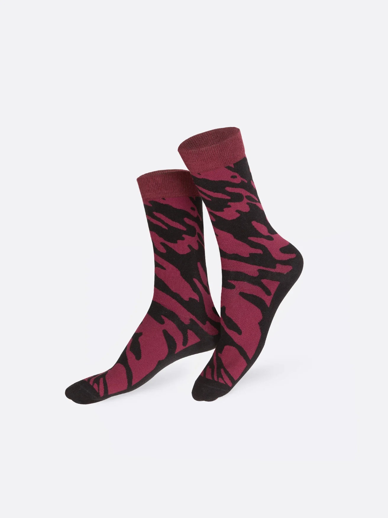 Black socks with splatters of dark purple printed on it