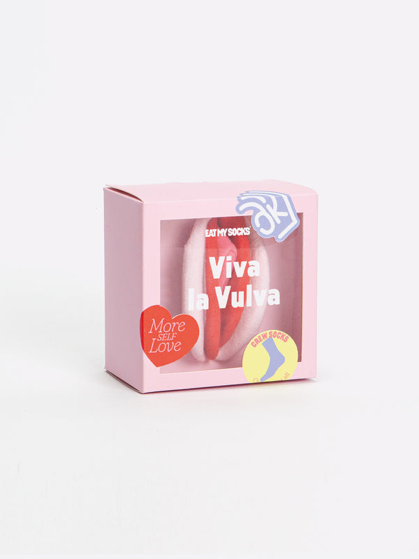 A pink box with a clear panel to display socks folded to resemble a vagina