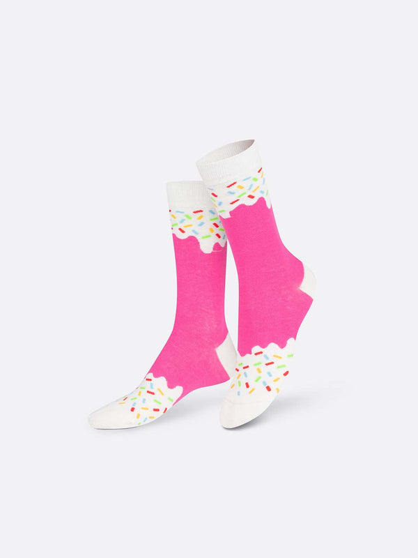Multicoloured socks with white toes with rainbow sprinkles, bubblegum pink ankles and shins and white with rainbow sprinkles on the calves