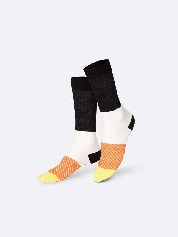 The socks displayed with different coloured sections such as yellow toes followed by orange with skinny white stripes, white with a black heel and black from the ankle up.
