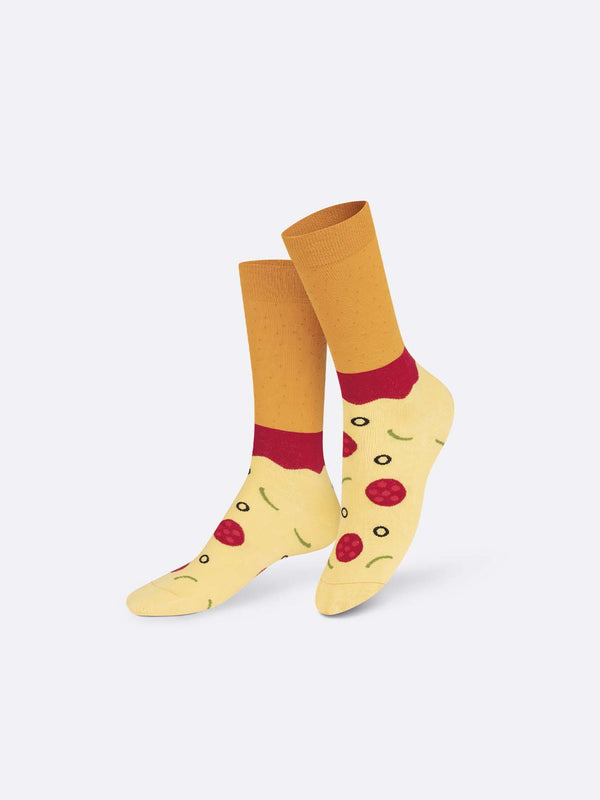 Multicoloured socks with beige feet with pepperoni, green peppers and olives printed on, red ankles and light brown shins
