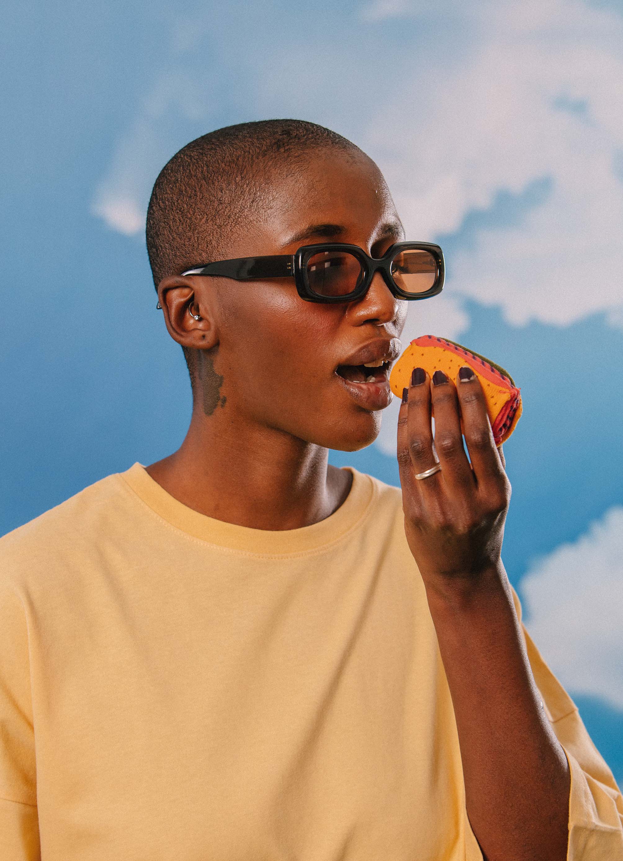 A model pretending to eat the taco socks